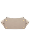 Womens Leather Shopping Bag and Toiletry Bag Set showing the bottom view with pebbled texture and metal studs.