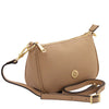 Leather Clutch Bag in caramel with gold hardware and adjustable strap.
