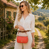 Model wearing a stylish Leather Clutch Bag outdoors, showcasing a chic casual look.
