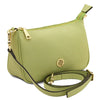 Leather Clutch Bag in lime green with adjustable strap and gold hardware.