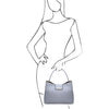 Woman Posing With The Light Blue Leather Handbag For Women