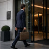 Man Walking With The Dark Taupe Leather Laptop Bag