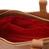 Interior view of the Genuine Leather Shoulder Bag for Women featuring a red lining and pockets.