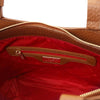 Interior view of the Genuine Leather Shoulder Bag for Women featuring a red lining and zipper pocket.