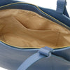 Interior view of a denim Genuine Leather Shoulder Bag for Women showcasing spacious compartments and a soft lining.