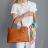 Woman Holding The Natural Leather Tote Bag