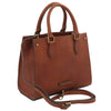 Angled And Shoulder Strap View Of The Brown Leather Tote Handbag