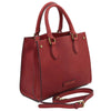 Angled And Shoulder Strap View Of The Red Leather Tote Handbag