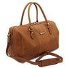 Angled And Shoulder Strap View Of The Natural Leather Travel Duffle Bag Small