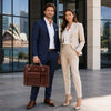 Professional Leather Bag being carried by a man in a suit and a woman in business attire, set in an urban environment.