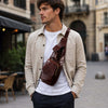 Man wearing a Leather Crossover Bag, showcasing its stylish design and practicality in an outdoor setting.