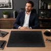 Leather Desk Pad on a modern office desk with a man in a suit, enhancing workspace elegance and functionality.