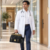 Male doctor in a white coat carrying a Italian Leather Doctors Bag in a modern office setting.