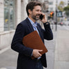 Man Holding The Brown Leather Document Case