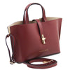 Angled And Shoulder Strap View Of The Bordeaux Leather Handbag