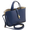 Angled And Shoulder Strap View Of The Dark Blue Leather Handbag