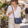 Beautiful Woman In A Market Carrying The Dark Blue Leather Ladies Handbag