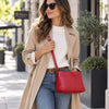Beautiful Woman In The Street Carrying The Lipstick Red Leather Ladies Handbag