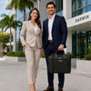 Stylish professionals standing outdoors, showcasing a Leather Laptop Briefcase Bag against a modern building backdrop.