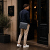 Man With The Grey Leather Messenger Bag For Men Over His Shoulder