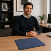 Leather Mouse Pad featured on a desk, with a man sitting at the desk in a modern office setting.