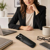 Leather Pen Pouch on a desk next to a laptop, glasses, and coffee, held by a woman in a black blazer.