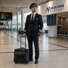 Pilot standing in airport with Leather Pilot Case With Wheels at Melbourne Airport.