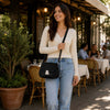 Woman wearing a Over The Shoulder Leather Bag, showcasing its stylish design during a casual outing.
