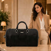 Leather Travel Duffel Bag displayed beside a woman in a stylish outfit, showcasing modern elegance and functionality.