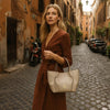 Woman Posing With The Beige Italian Handbag