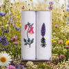 Ladies Handkerchief with Wild Flower Embroidery in a decorative box amidst a field of colorful flowers.