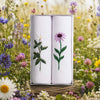 Ladies Handkerchief with Wild Flower Embroidery displayed in a box against a field of colorful flowers.