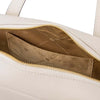 Interior view of a Luxury Leather Shoulder Bag featuring a gold lining and gold zipper detailing.
