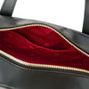 Interior view of the Luxury Leather Shoulder Bag showcasing red lining and zipper details.