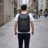 Man walking in the city wearing a Laptop Backpack Australia, showcasing its sleek design and durable material.
