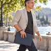 Man Walking And Holding The Dark Blue Mens Italian Leather Clutch Bag