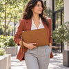 Woman Walking And Holding The Natural Mens Italian Leather Clutch Bag