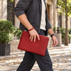 Man Walking And Holding The Red Mens Italian Leather Clutch Bag