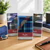 Mens Quality 10 Pack Handkerchiefs displayed in stylish packaging on a wooden table with accessories.