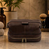 Mens Toiletry Bag Leather in brown leather with dual zip closure, perfect for organizing essentials.