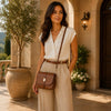 Stylish woman wearing Leather Over Shoulder Bag in a chic outdoor setting.