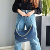 Woman Posing With The Dark Blue Over The Shoulder Bag