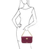 Woman Posing With The Plum Over The Shoulder Handbag