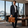 Professional Leather Briefcase held by a man in a suit, showcasing elegance and functionality in a modern office setting.