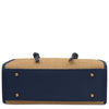 Raffia Shoulder Bag bottom view showcasing woven raffia and blue leather accents with gold hardware.