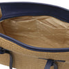 Interior view of Raffia Shoulder Bag showcasing spacious compartment and zip pocket.