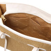 Interior view of the Raffia Shoulder Bag showcasing spacious design with pockets for organization.
