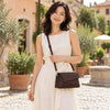 Woman wearing a stylish Shoulder Bag For Ladies, set against a picturesque outdoor backdrop.