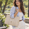 Beautiful Woman In The Park Carrying The Beige Shoulder Bags For Women