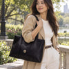 Beautiful Woman In The Park Carrying The Black Shoulder Bags For Women